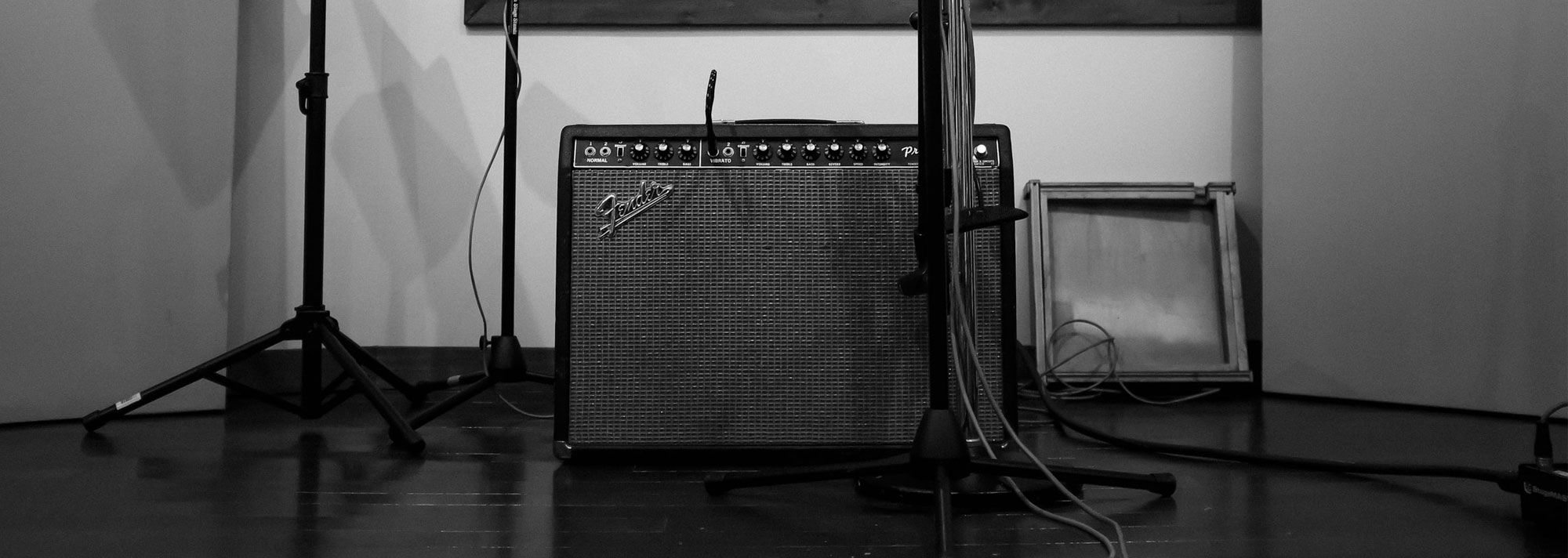 Fender Princeton amplifier with music stand and microphone in a recording studio booth